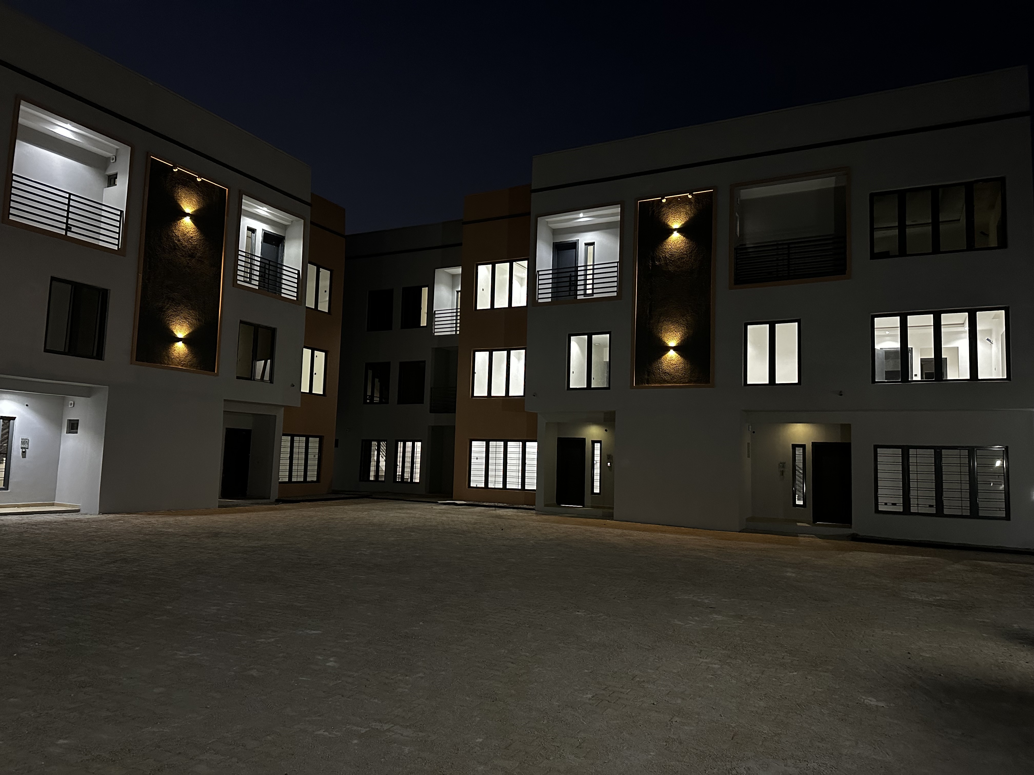 Well-maintained illuminated courtyard at Andrews Court in Asokoro