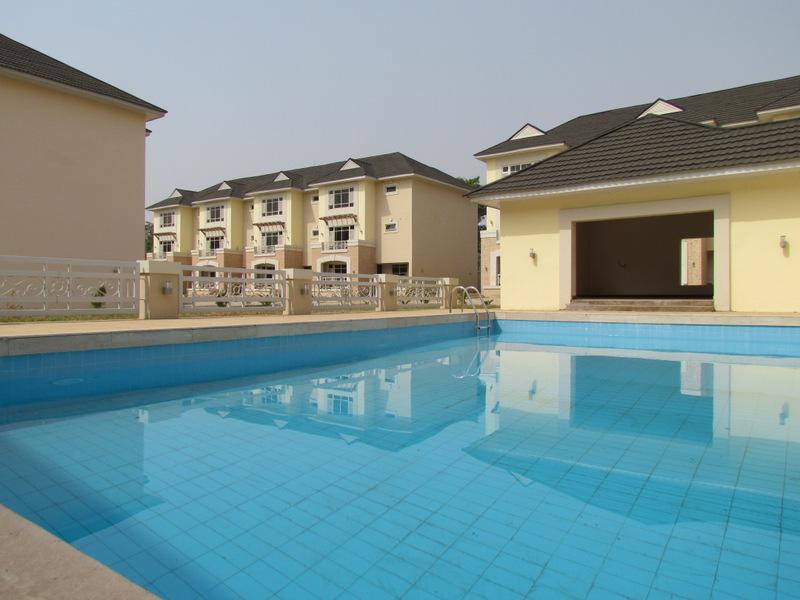 Communal swimming pool and residences at Weiboro Gardens in Life Camp, Abuja